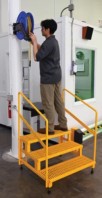 Vestil ASP-36-3-HR adjustable step stands with handrail shown from an alternate angle