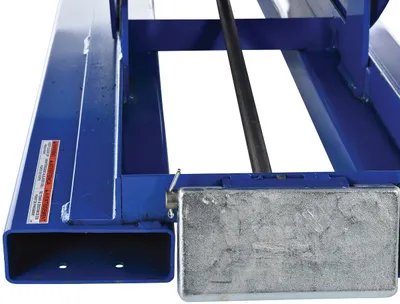 Vestil D-100-LD d style - self-dumping steel hoppers with bumper release shown from an alternate angle