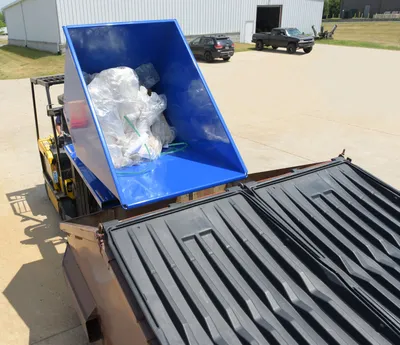 Vestil D-150-HD d style - self-dumping steel hoppers with bumper release shown from an alternate angle
