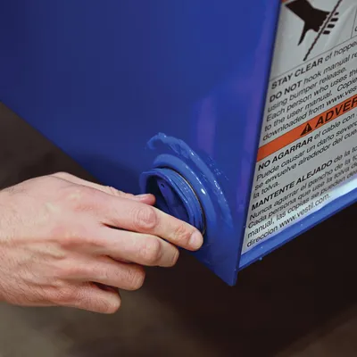 Vestil D-DPLG-2 d style - self-dumping steel hoppers with bumper release shown from an alternate angle