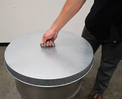 Vestil DC-245-H galvanized steel drum cover shown from an alternate angle