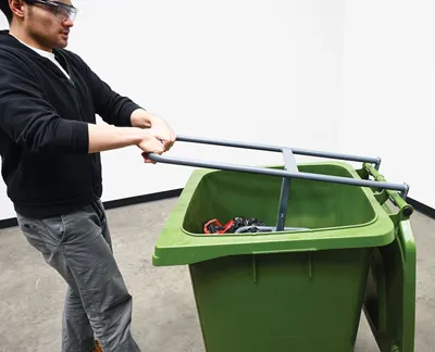 Vestil MBC-1513-14 manual trash bin compactor shown from an alternate angle